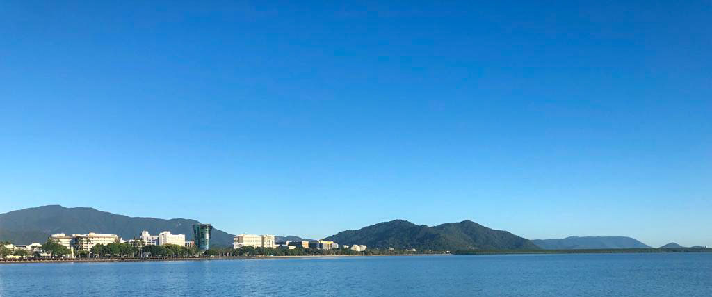 World Transformation Movement North Queensland - Contact Cairns township and harbour with big sky background - World Transformation Movement North Queensland image