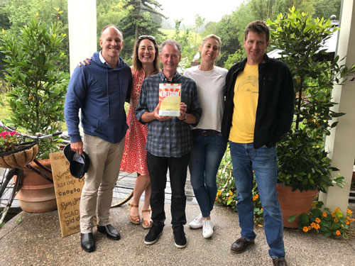 WTM members meet in NZ with Peter Sadler Founding WTM members with Peter Sadler holding the book FREEDOM